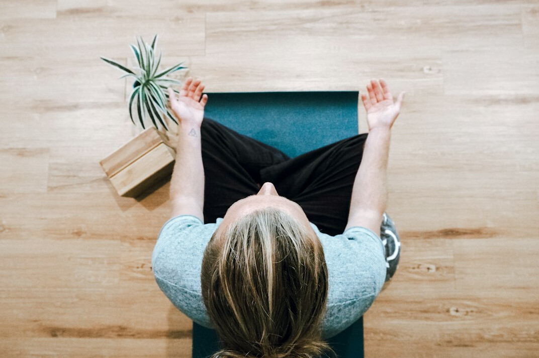 person doing breathing exercise