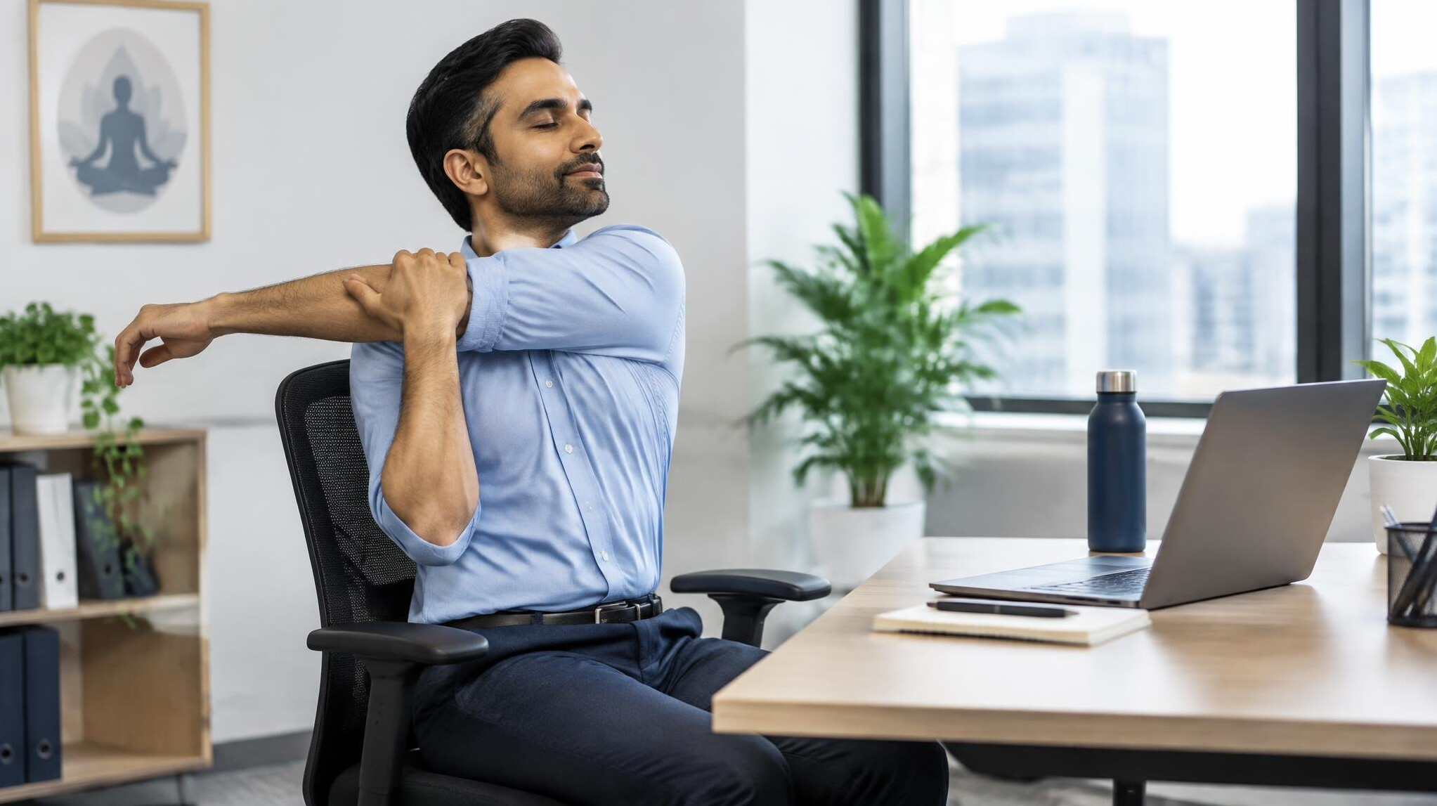 man stretching in office chair