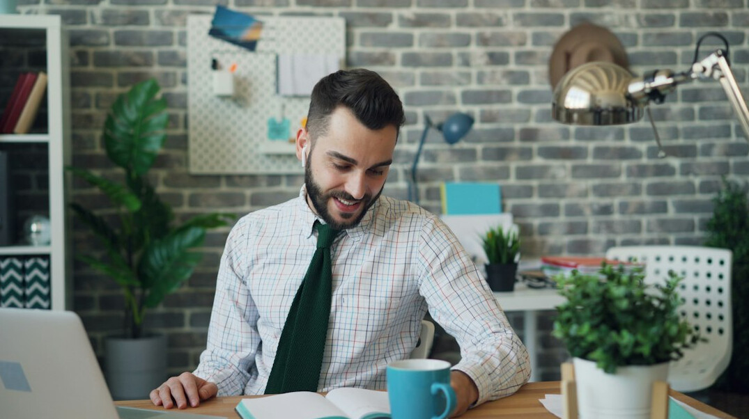 person meditating in modern office