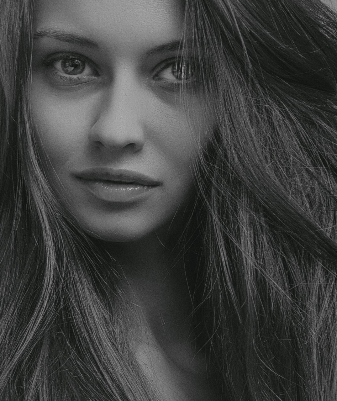 Portrait of a young woman with long hair